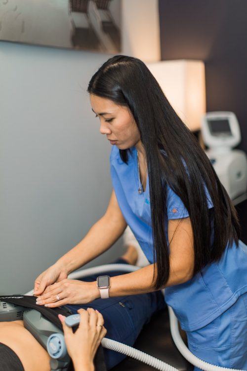 applying emsculpt neo to patient in sarasota at lakeshore chiropractic